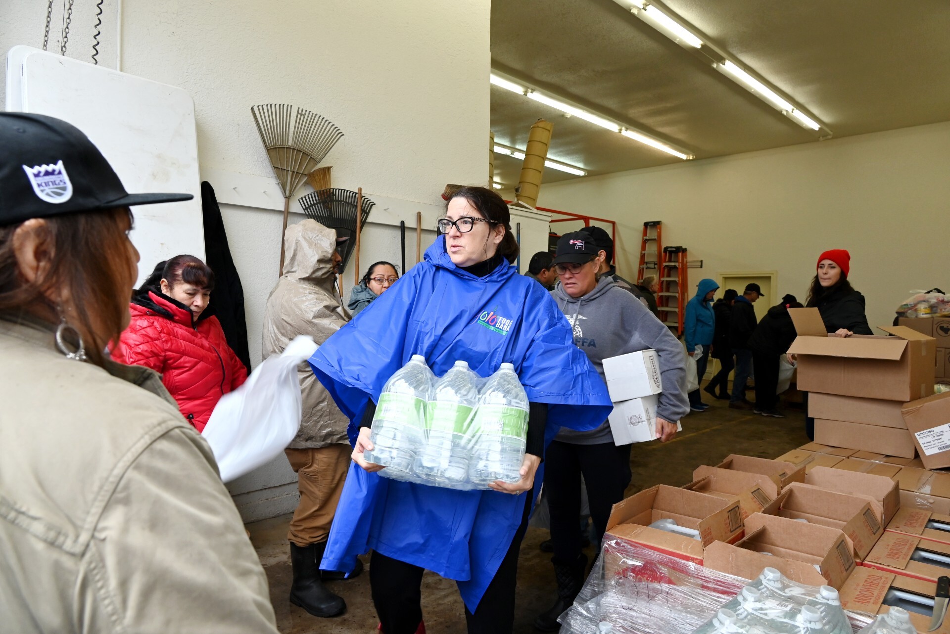 Volunteers distribute emergency food and water during severe storm event.
